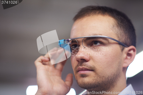 Image of man using virtual reality gadget computer glasses