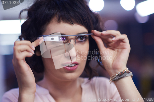 Image of woman using virtual reality gadget computer glasses