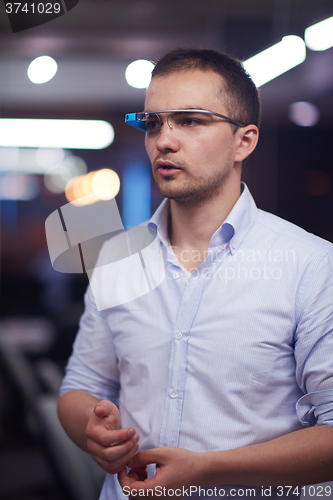 Image of man using virtual reality gadget computer glasses