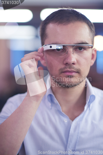 Image of man using virtual reality gadget computer glasses