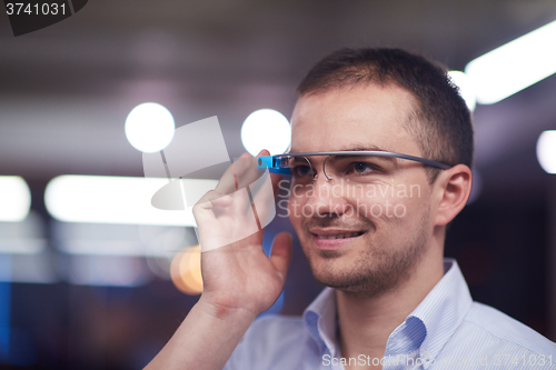 Image of man using virtual reality gadget computer glasses