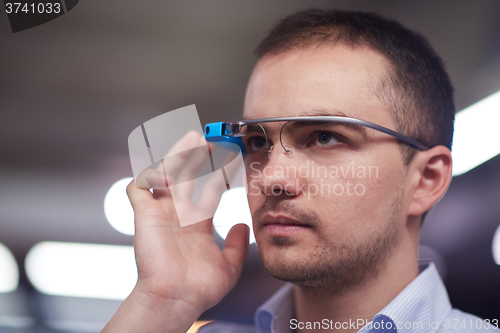 Image of man using virtual reality gadget computer glasses