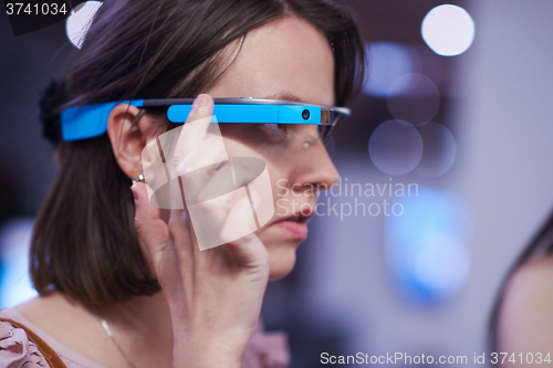 Image of woman using virtual reality gadget computer glasses