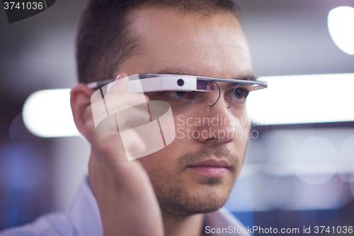 Image of man using virtual reality gadget computer glasses