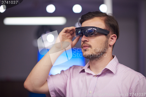 Image of man using virtual reality gadget computer glasses