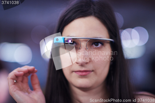 Image of woman using virtual reality gadget computer glasses