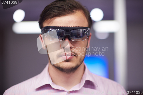 Image of man using virtual reality gadget computer glasses