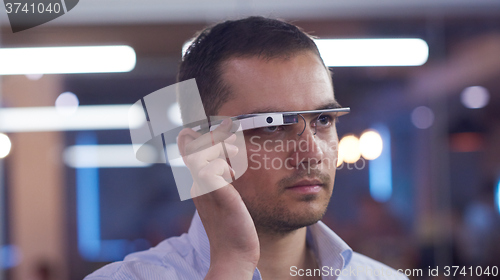 Image of man using virtual reality gadget computer glasses