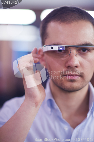 Image of man using virtual reality gadget computer glasses