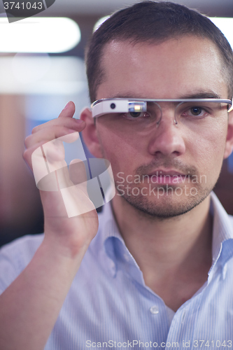 Image of man using virtual reality gadget computer glasses