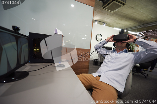 Image of man using virtual reality gadget computer glasses