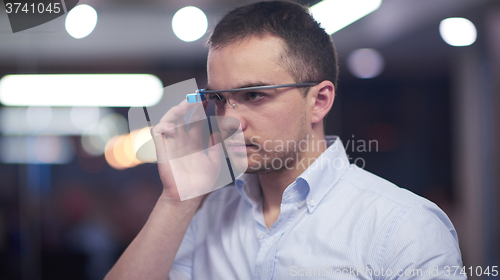 Image of man using virtual reality gadget computer glasses