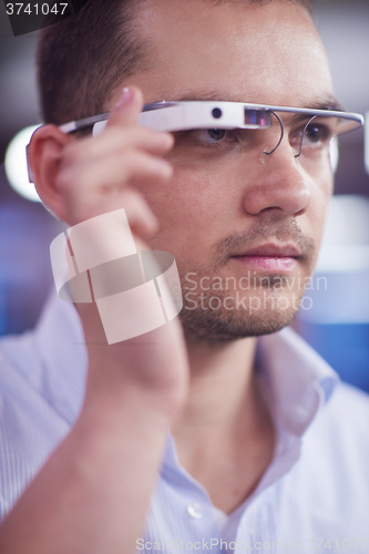 Image of man using virtual reality gadget computer glasses