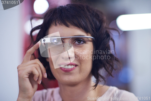 Image of woman using virtual reality gadget computer glasses