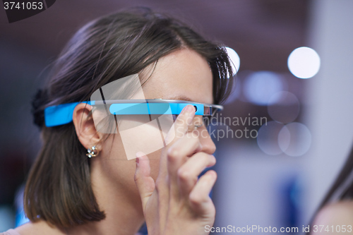 Image of woman using virtual reality gadget computer glasses