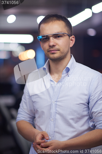 Image of man using virtual reality gadget computer glasses