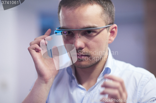 Image of man using virtual reality gadget computer glasses