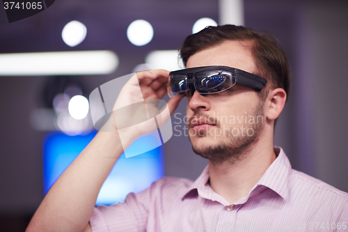 Image of man using virtual reality gadget computer glasses