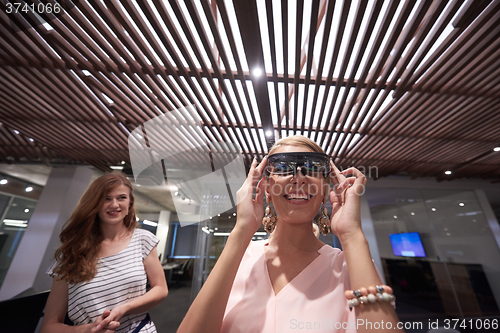 Image of woman using virtual reality gadget computer glasses