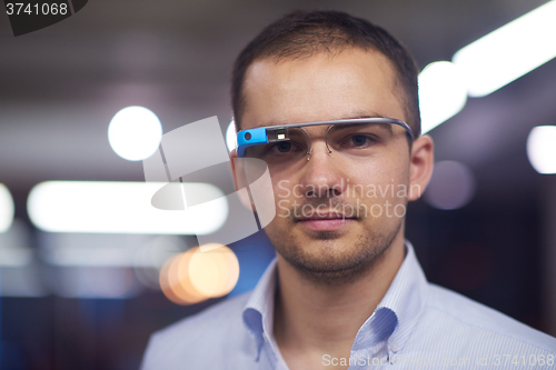 Image of man using virtual reality gadget computer glasses