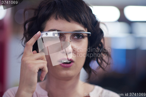 Image of woman using virtual reality gadget computer glasses