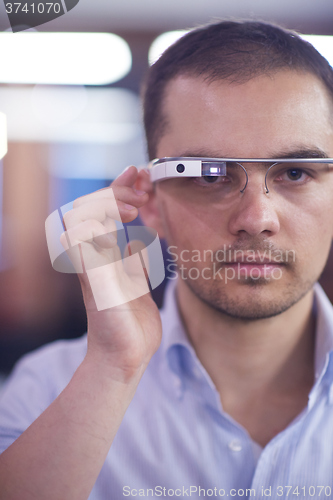 Image of man using virtual reality gadget computer glasses