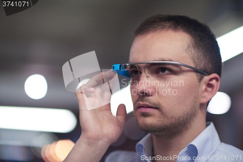 Image of man using virtual reality gadget computer glasses