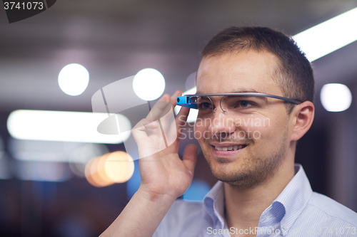 Image of man using virtual reality gadget computer glasses