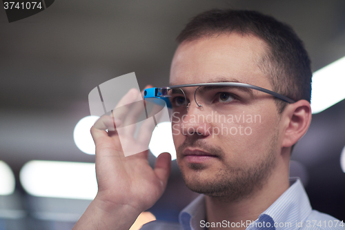 Image of man using virtual reality gadget computer glasses