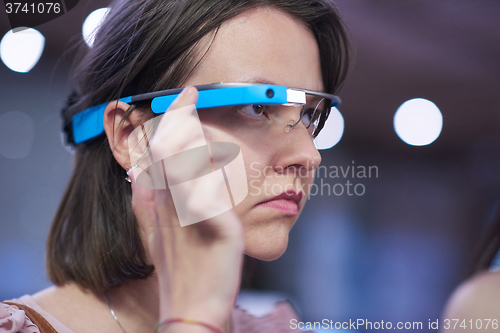 Image of woman using virtual reality gadget computer glasses