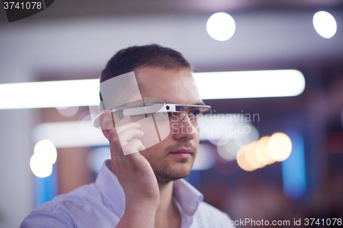 Image of man using virtual reality gadget computer glasses