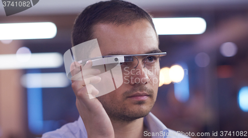 Image of man using virtual reality gadget computer glasses