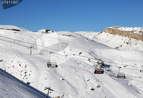 Image of Ski slope and chair-lift at sun day