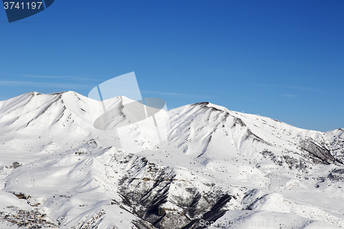 Image of Snowy winter mountains at nice sun day