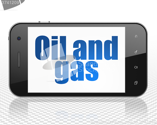 Image of Manufacuring concept: Smartphone with Oil and Gas on display