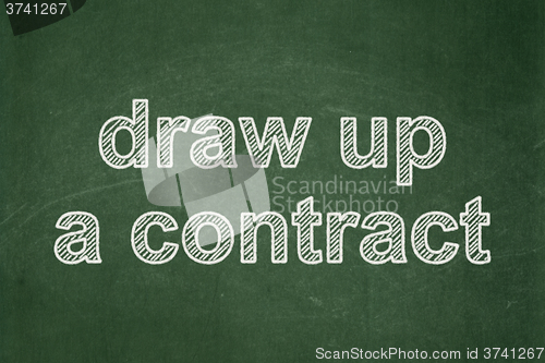 Image of Law concept: Draw up A contract on chalkboard background