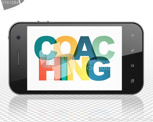 Image of Education concept: Smartphone with Coaching on  display