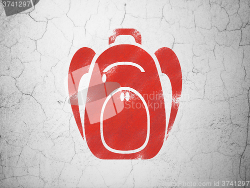Image of Education concept: Backpack on wall background
