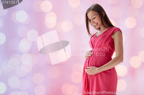 Image of happy pregnant woman with big tummy