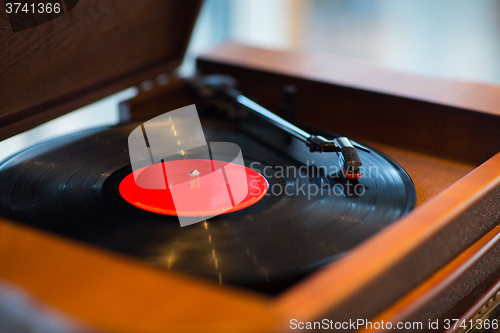 Image of close up of vintage record player with vinyl disc