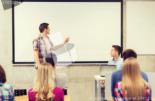 Image of group of students and teacher in classroom