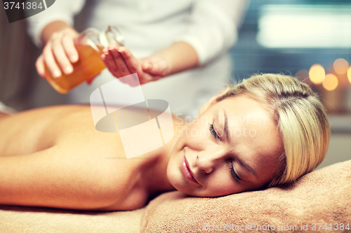 Image of close up of woman lying on massage table in spa