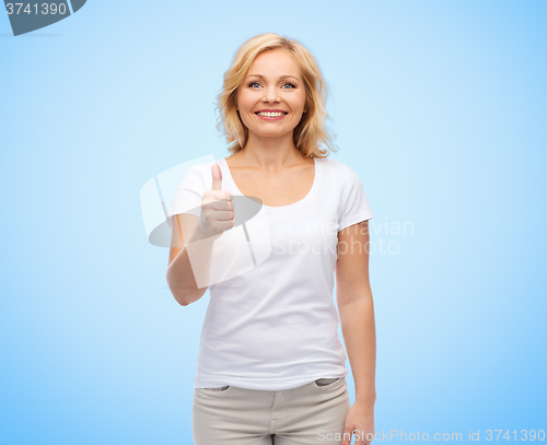 Image of smiling woman in white t-shirt showing thumbs up
