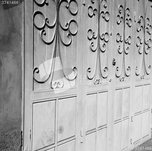 Image of blue morocco old door and historical nail wood