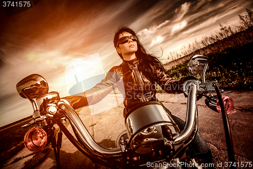 Image of Biker girl on a motorcycle