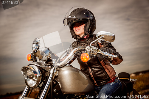 Image of Biker girl on a motorcycle