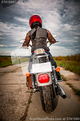 Image of Biker girl on a motorcycle