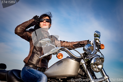 Image of Biker girl on a motorcycle