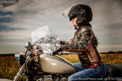 Image of Biker girl on a motorcycle