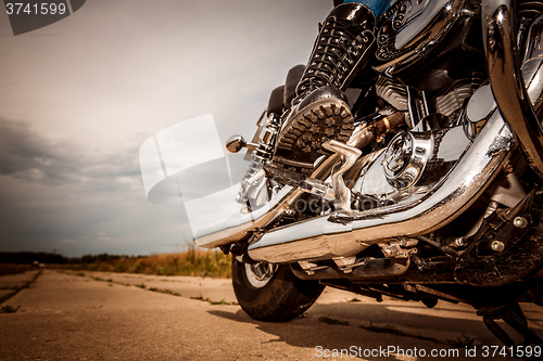 Image of Biker girl riding on a motorcycle